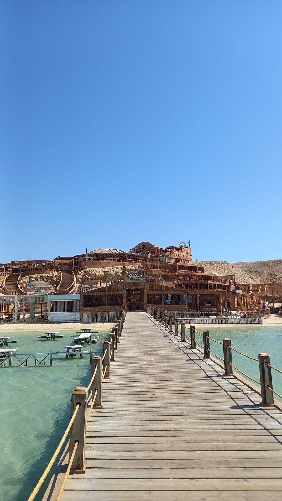 Wooden jetty leading to the beach restaurant at Orange Bay