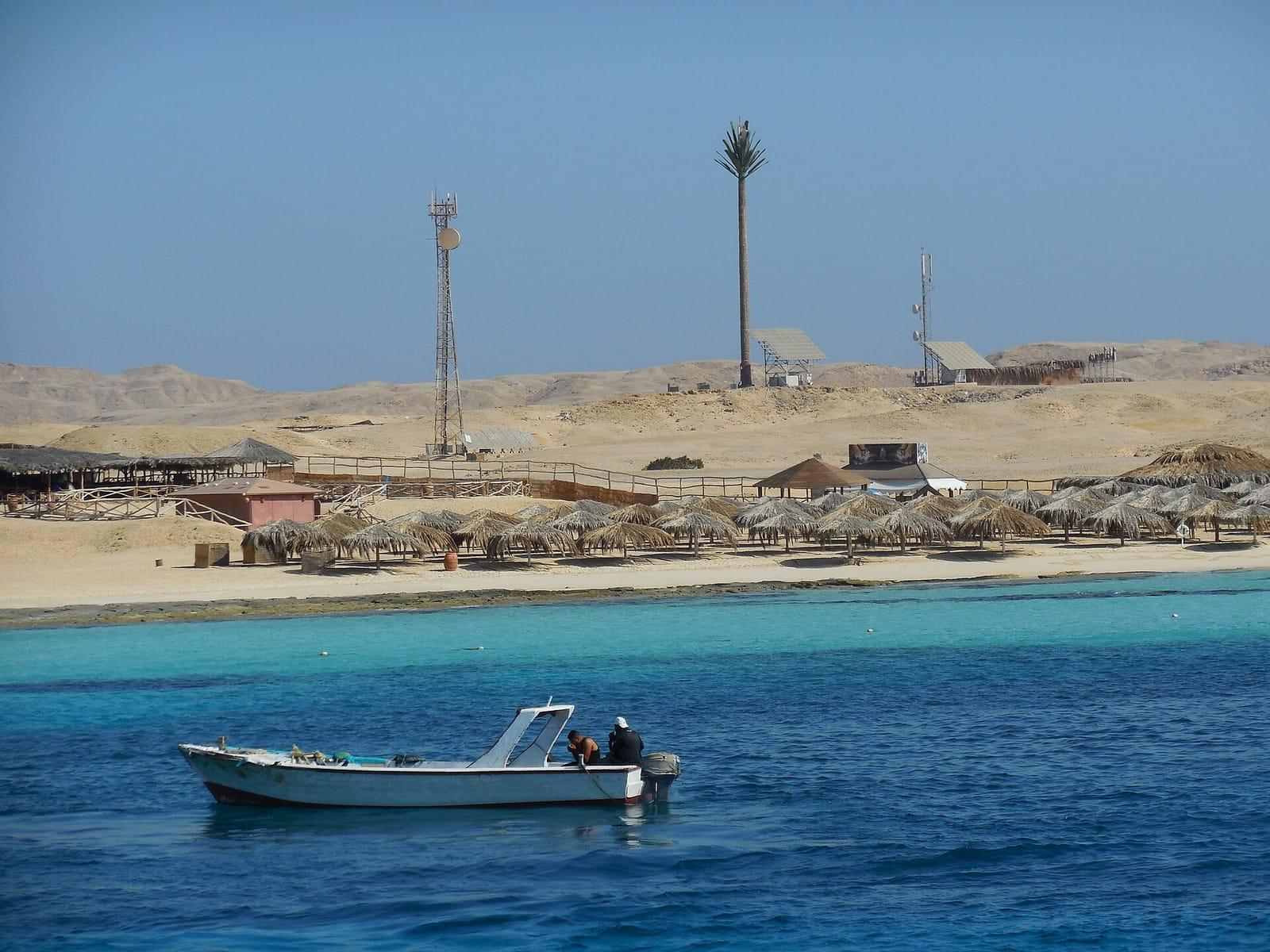 Boats moored off a low sandy island near Hurghada